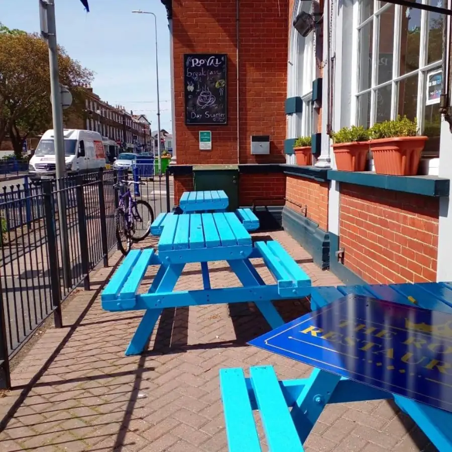 Outdoor seating area in front of the hotel